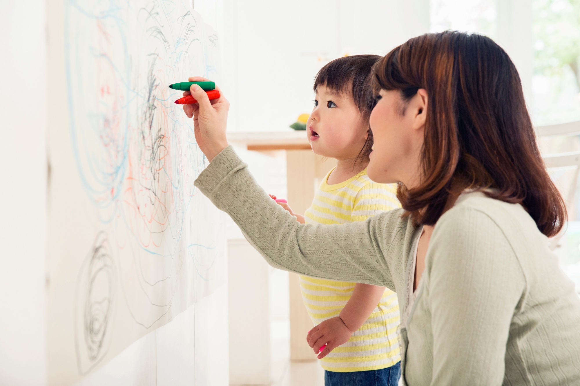 Mother and toddler drawing